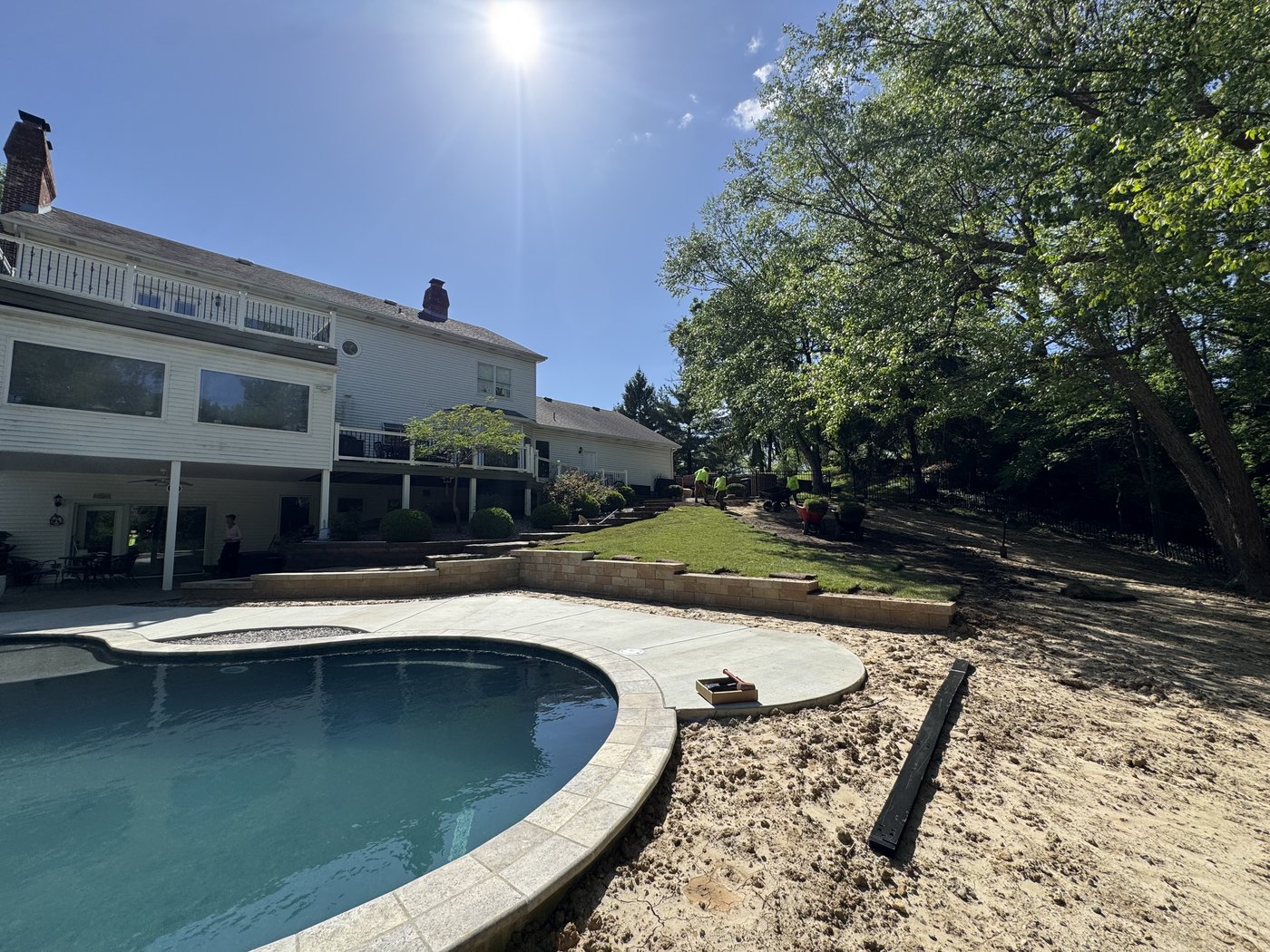After โ fresh sod installation transforming the pool surround